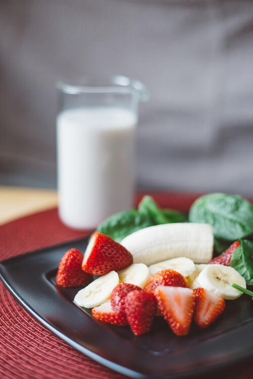 Strawberries with a glass of milk