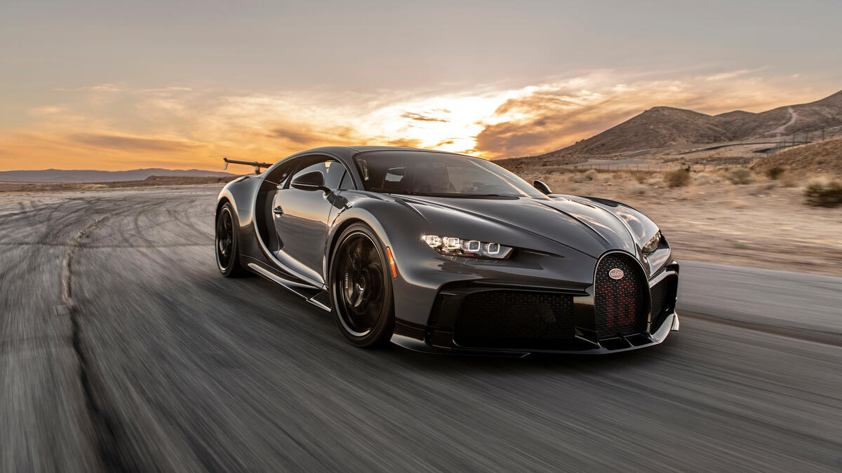 Bugatti chiron pur sport speeding away.