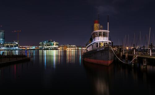 A ship on the dock at night