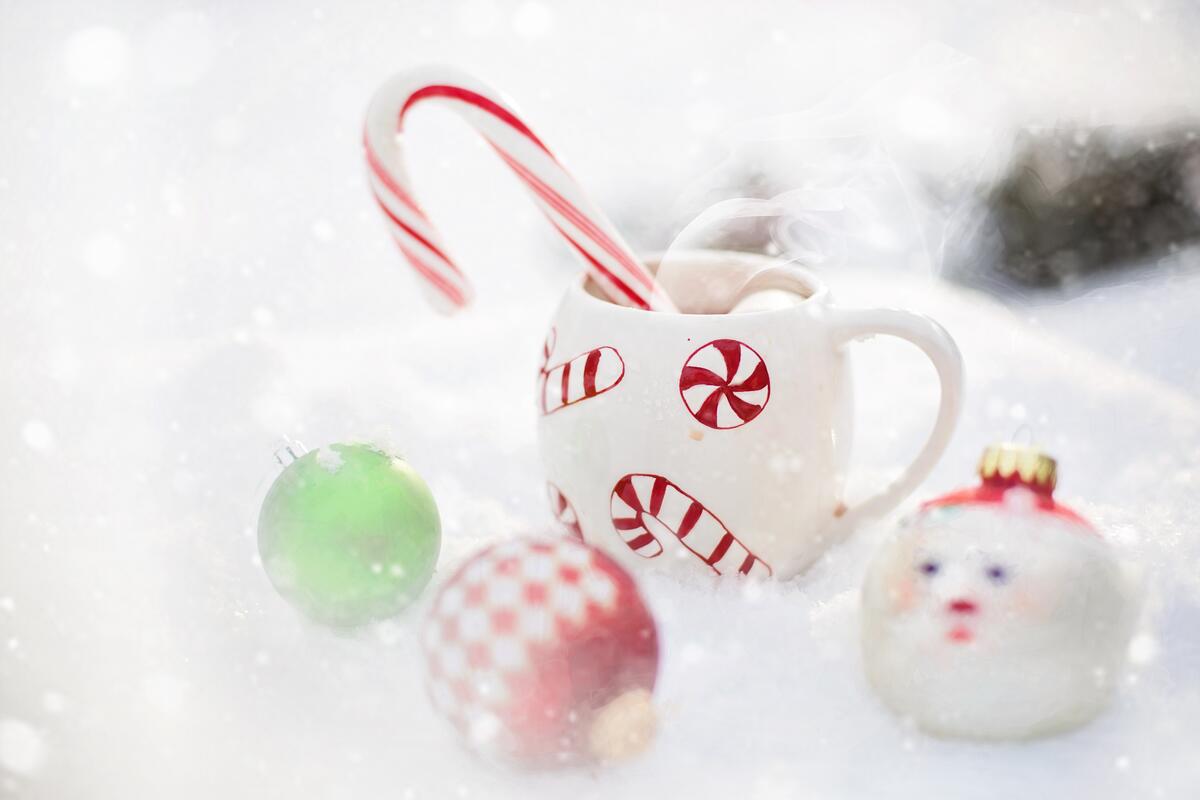 New Year`s mug with Christmas toys standing in the snow