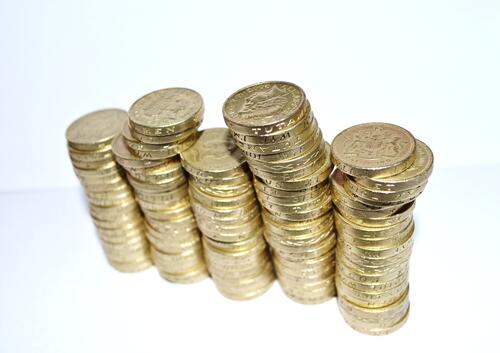 Stacks of coins on a light background