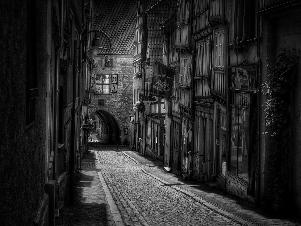 A city street in an old town in a monochrome photo