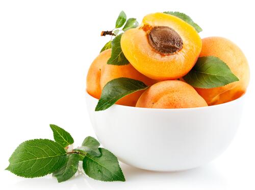 Ripe apricots in a deep bowl
