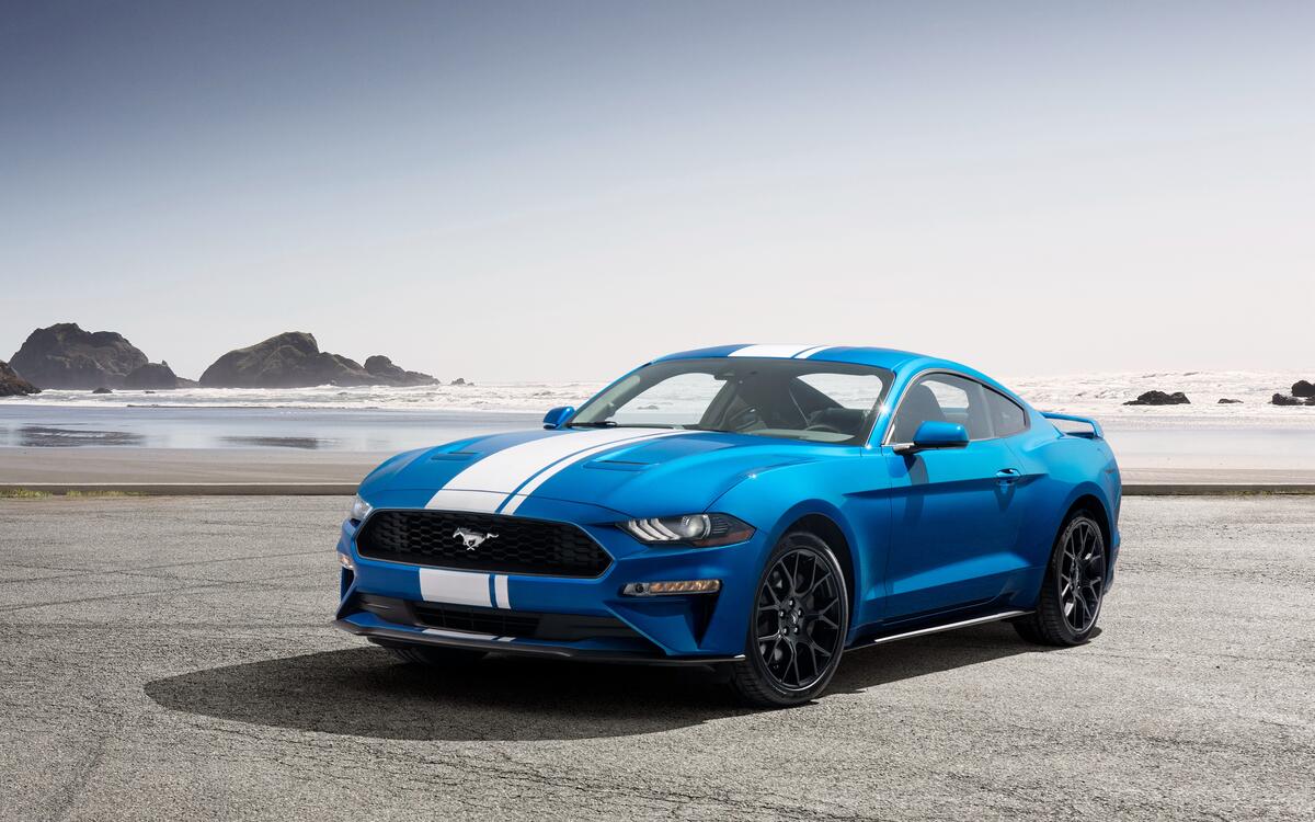 Blue Ford Mustang with white stripes