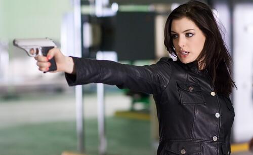 Anne Hathaway with a gun.