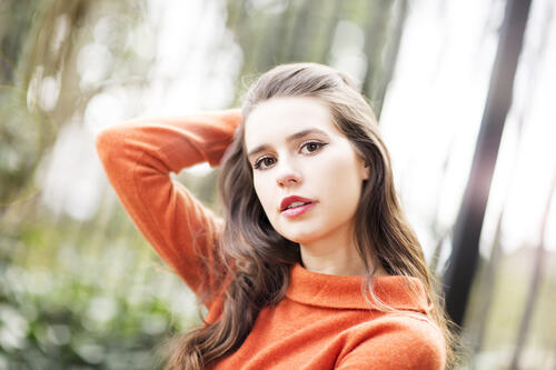 Philippa Coulthard in an orange sweater