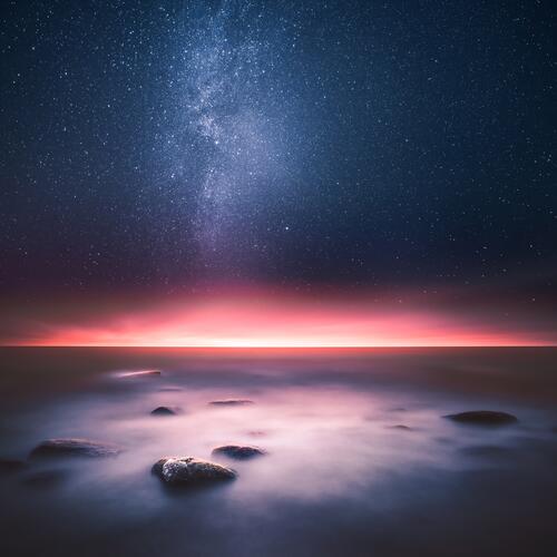 Nighttime ocean shore with the Milky Way in the sky