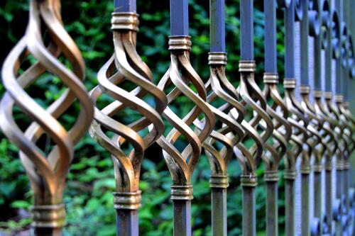 Decorative bronze elements on the bridge fence