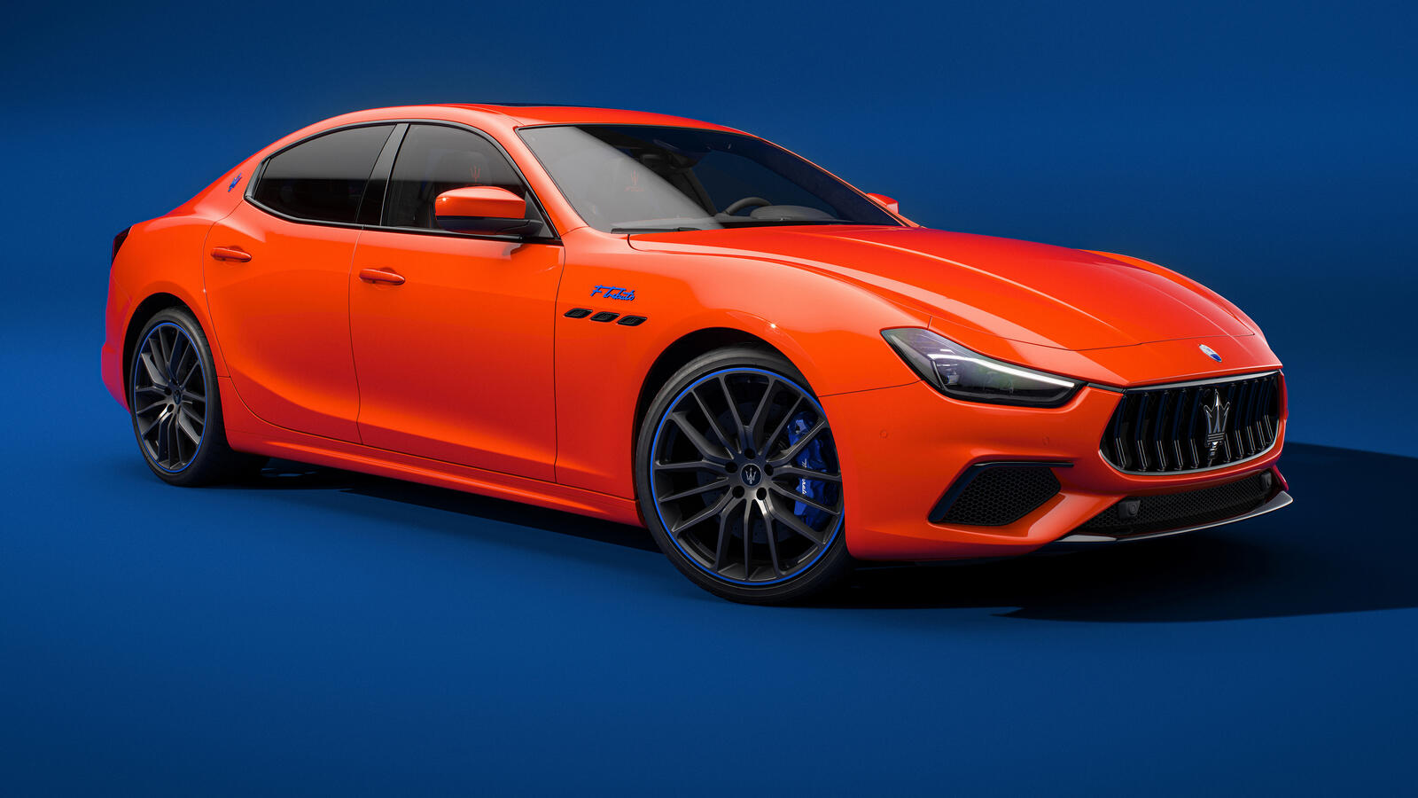 Бесплатное фото Maserati Ghibli FTributo 2022 года оранжевого цвета