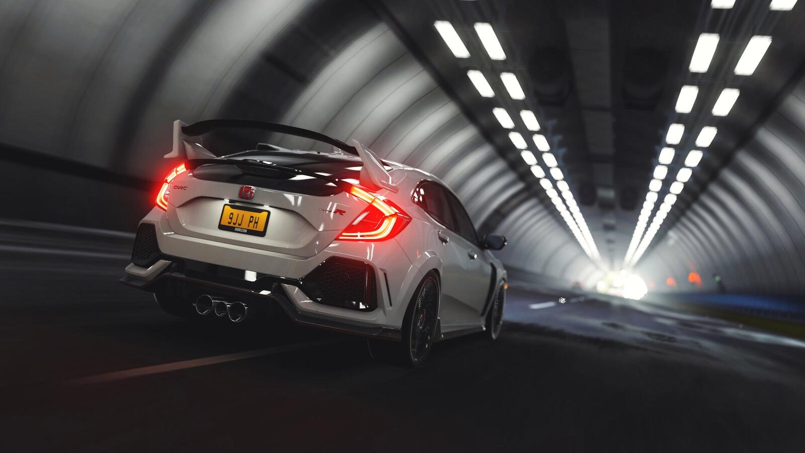 Free photo White Honda Civic Type R with spoiler drives in a tunnel