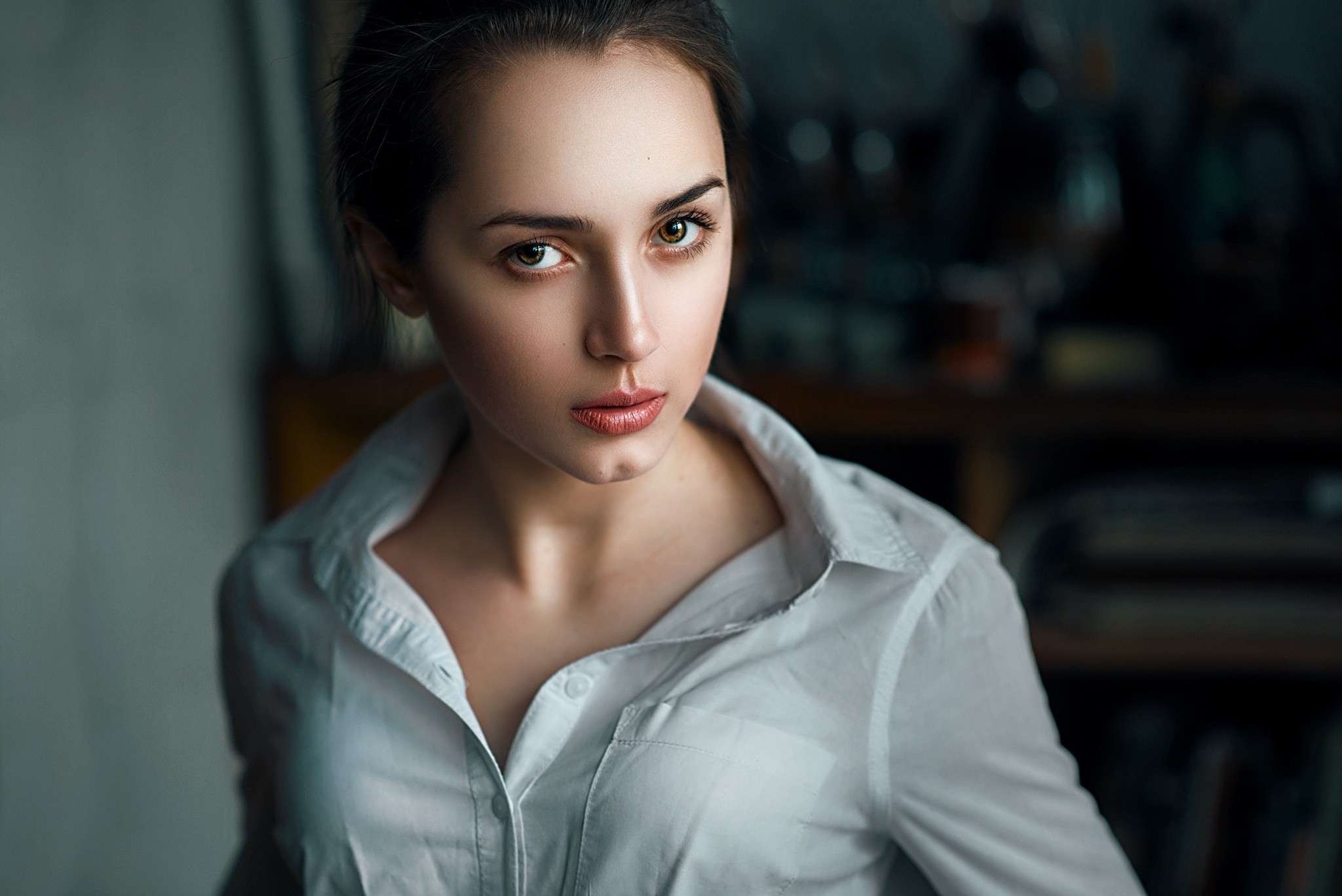 Brown-eyed girl in a white blouse