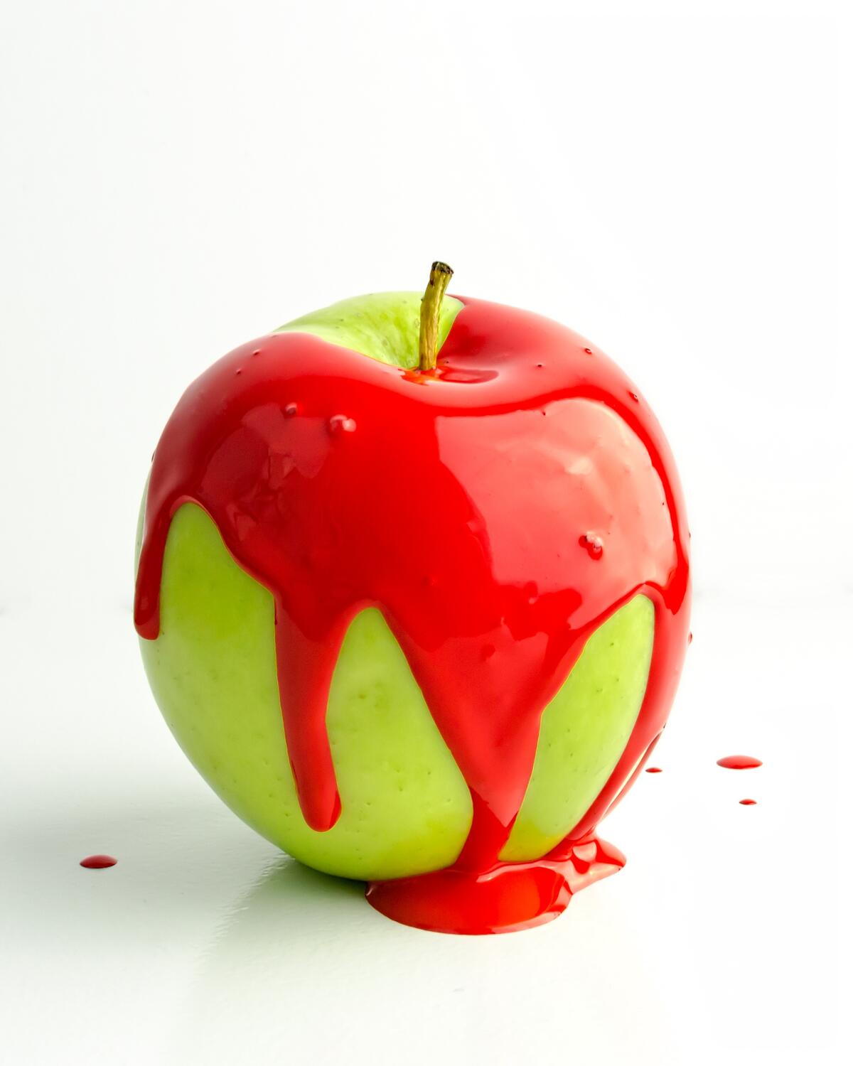 Green apple covered with red glaze