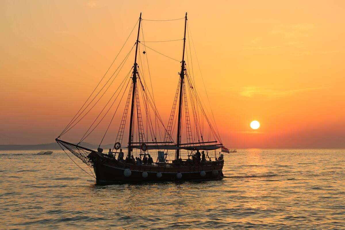 A ship without sails at sunset