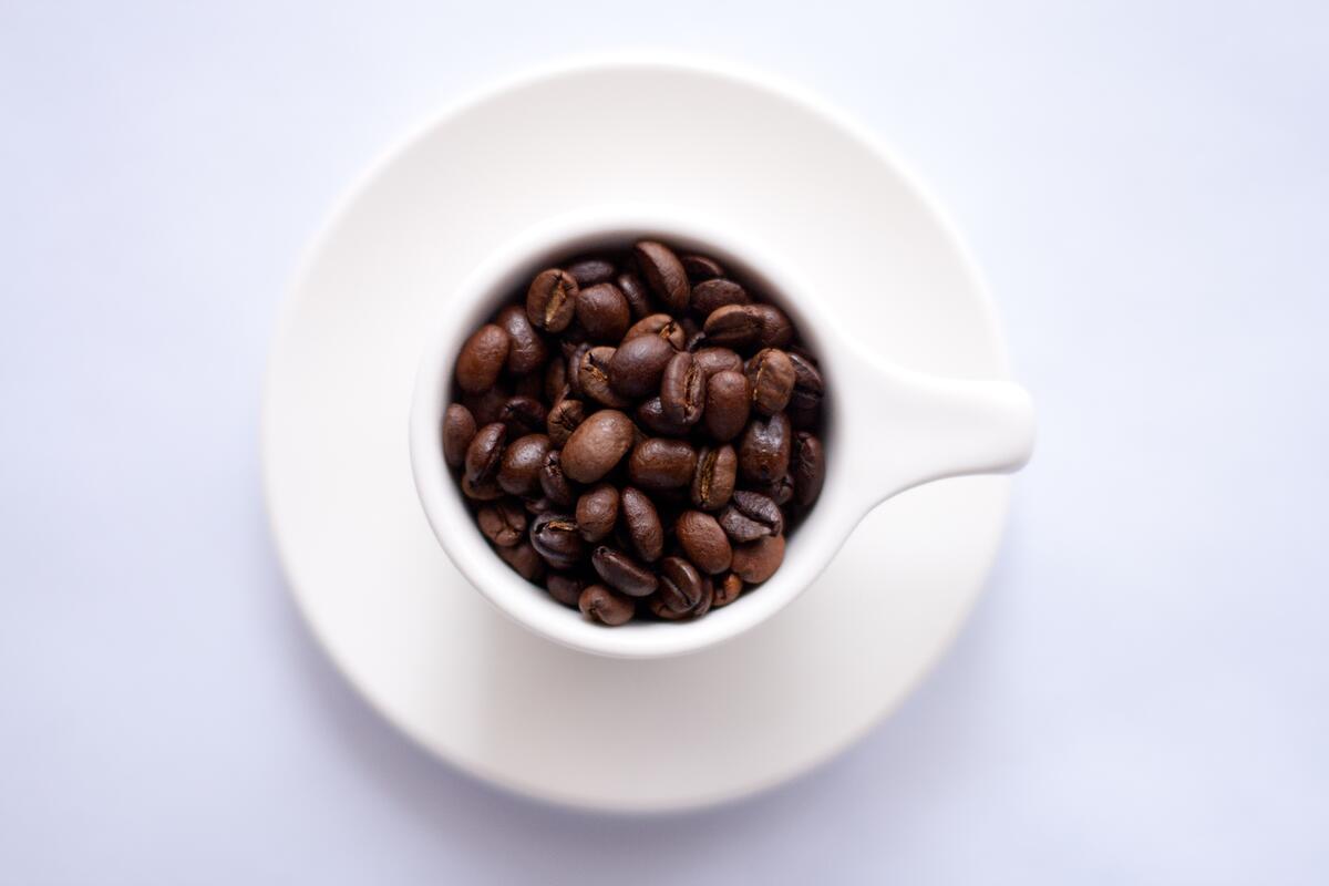 A cup filled with coffee beans