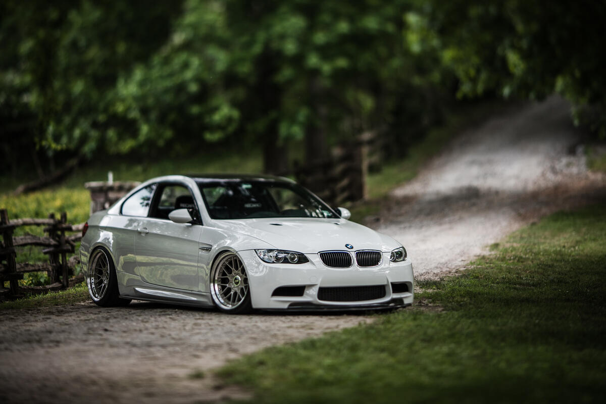 White bmw m3 e92 coupe on a dirt road
