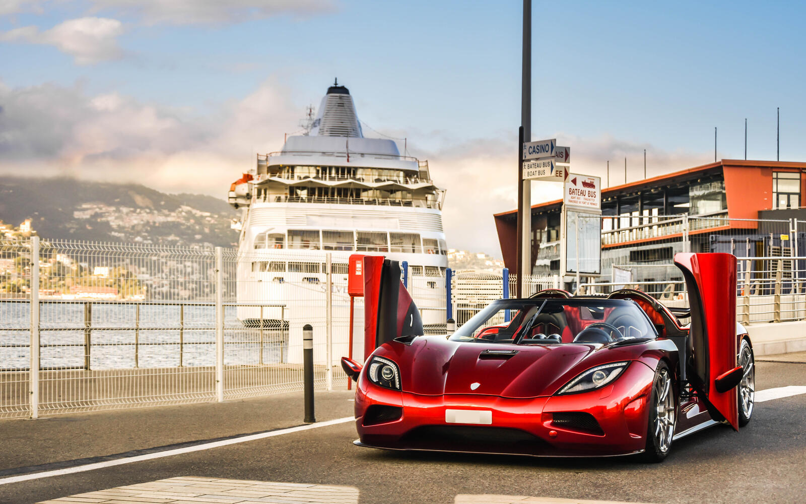 Free photo Red Koenigsegg Agera with open doors up
