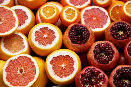 Citrus fruits in cut grapefruit with pomegranate