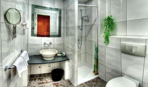 Bathroom interior with white tiles on the walls