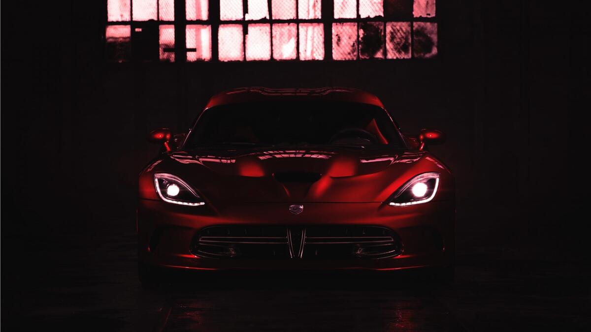 A red Dodge Viper in the dark.