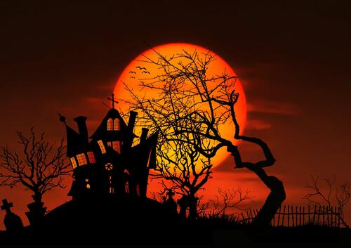 Silhouette of a witch`s house on Halloween