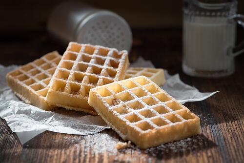 Delicious waffles in powdered sugar