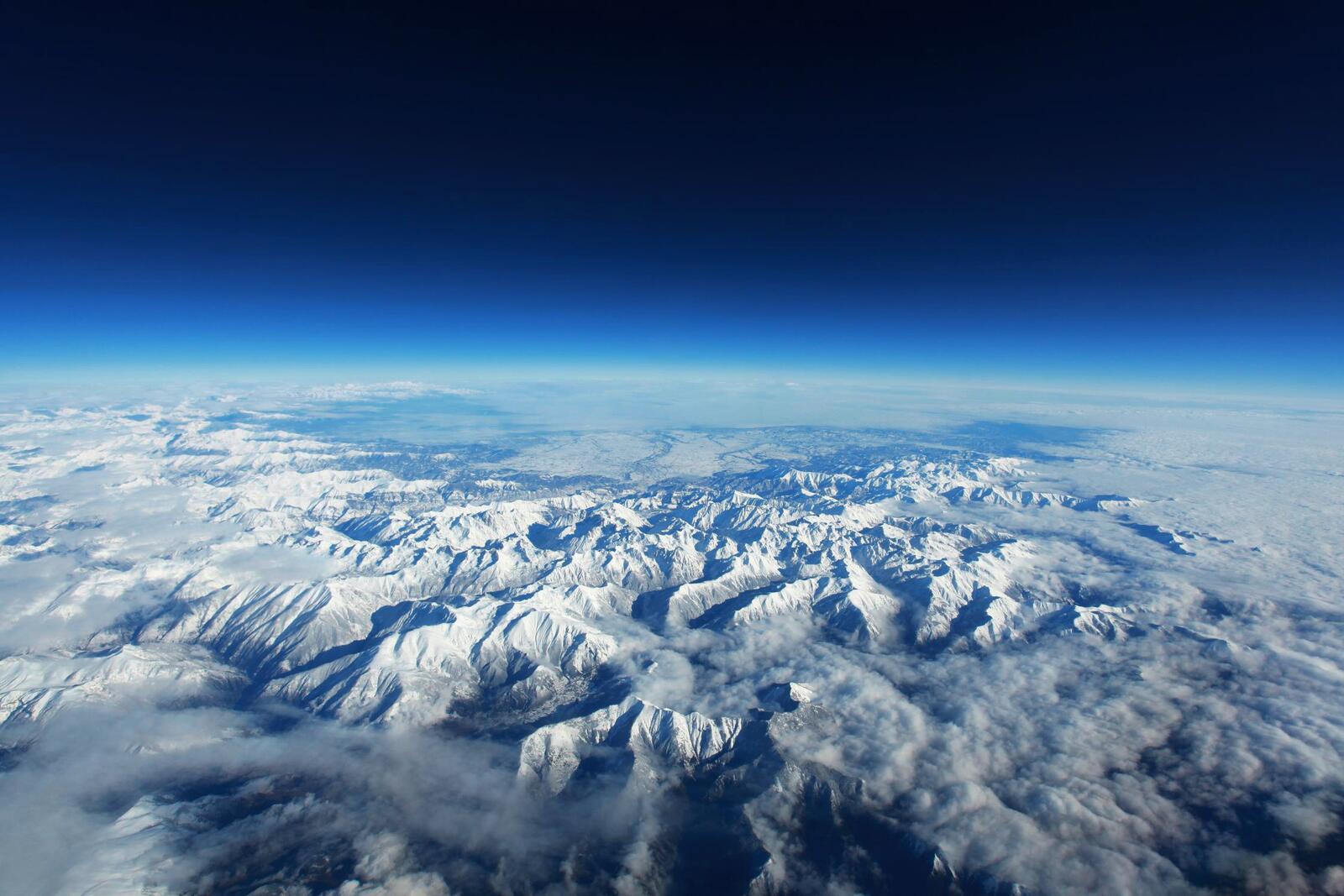 Free photo View of snowy peaks from space