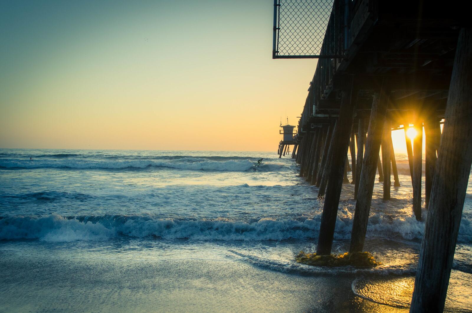 Free photo Wallpaper of an old pier at sunset