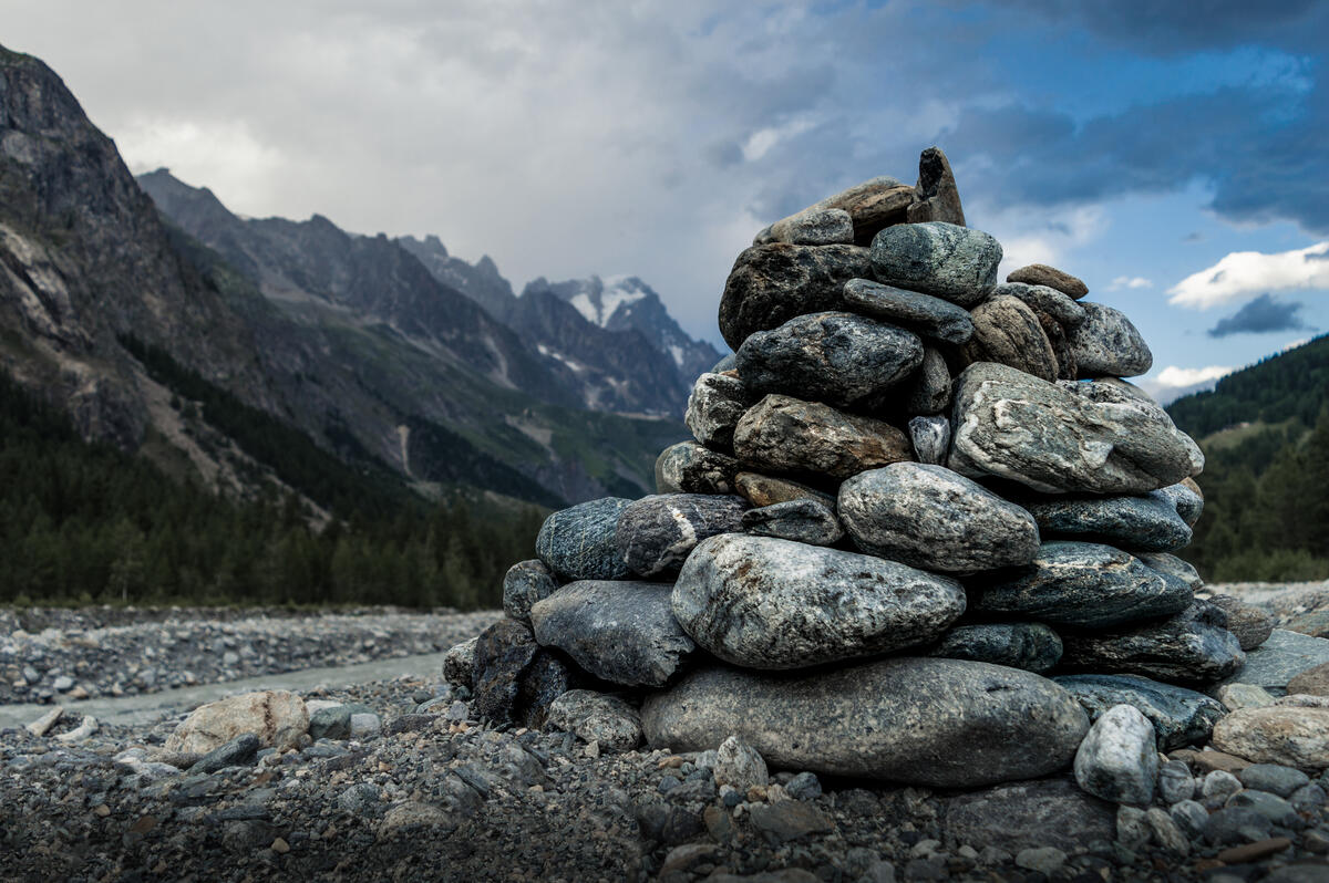 A tower of river stones in a mountainous area