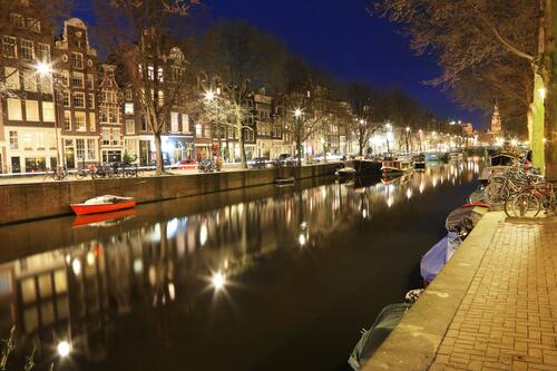 The night water canal in the city of Amsterdam