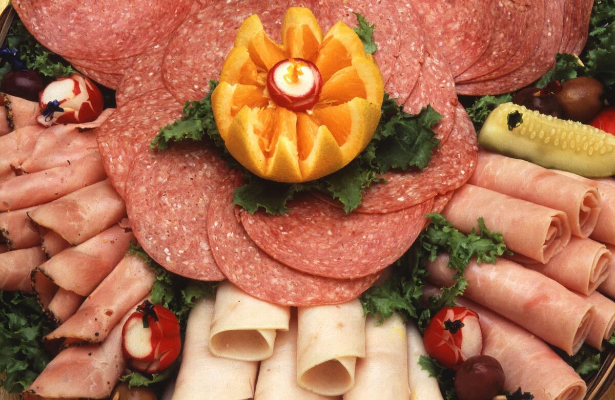A table decorated with sausage slices.