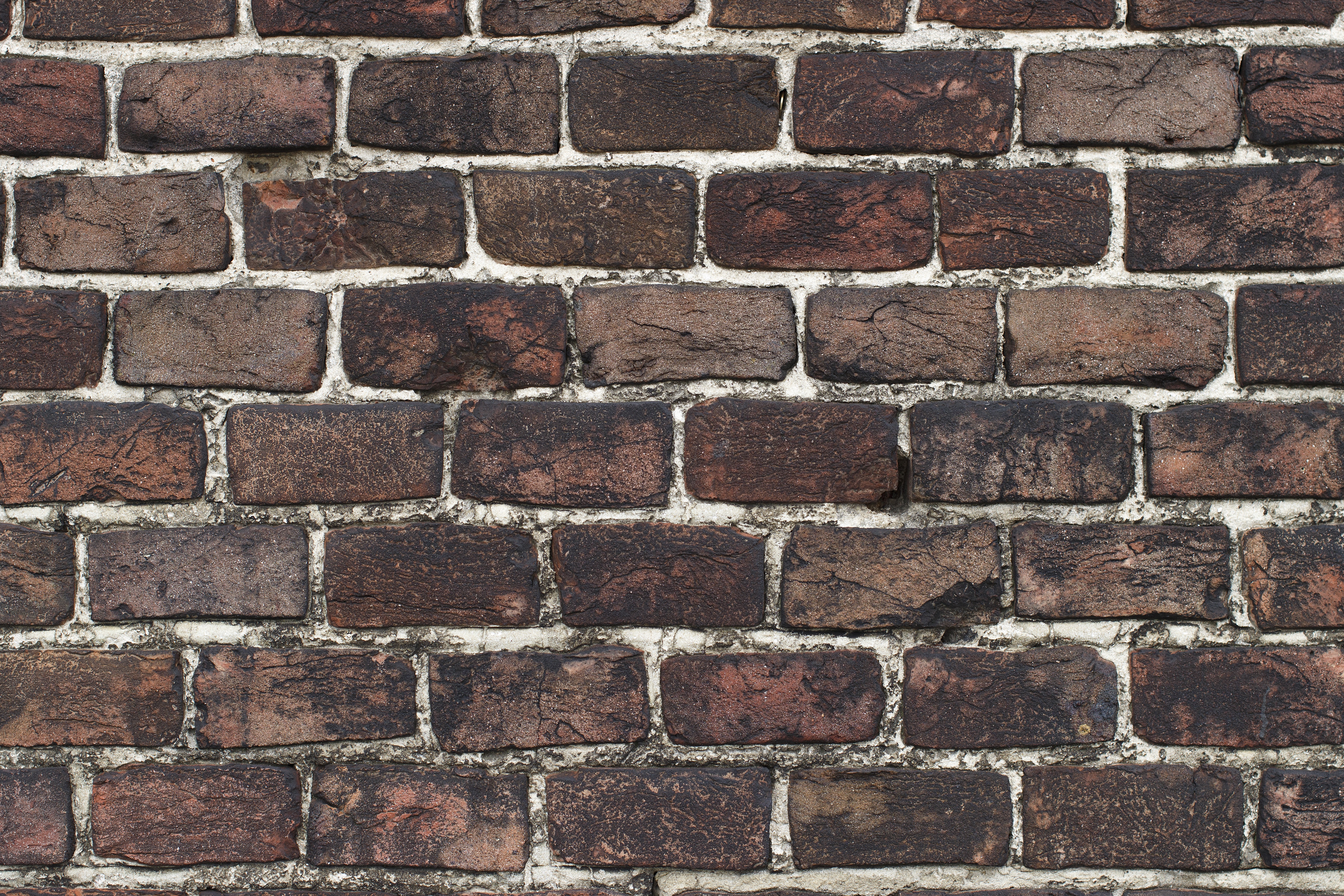 Free photo Wallpaper depicting a wall of large bricks