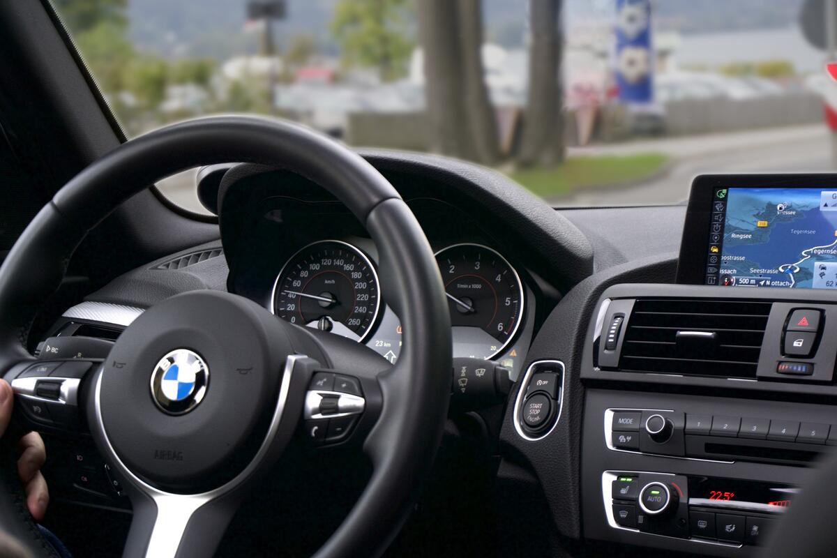BMW interior on the driver`s side of the steering wheel