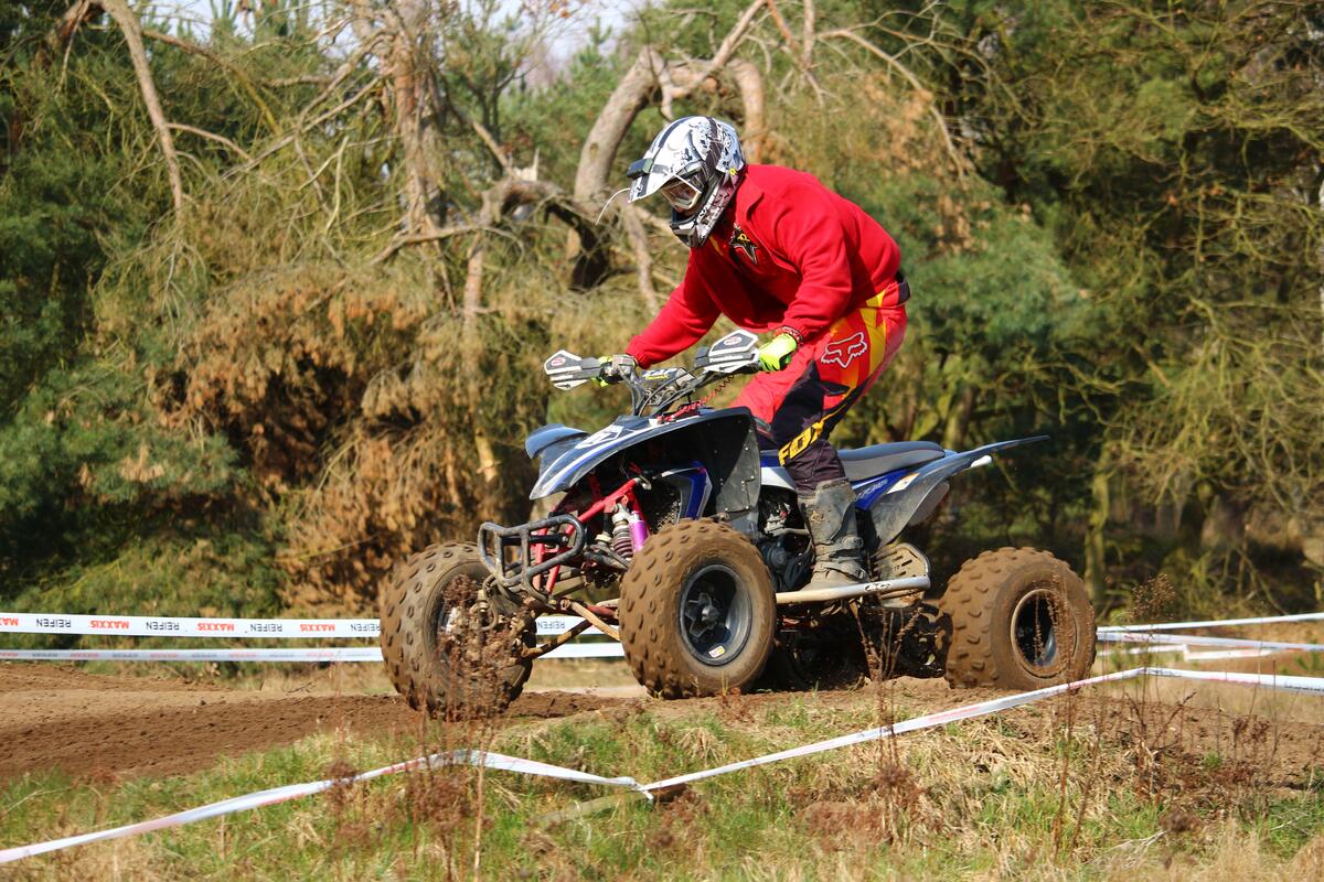 Racing an ATV through the mud