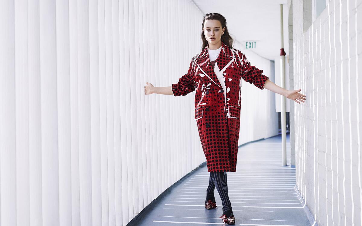 Katherine Langford in a red coat.