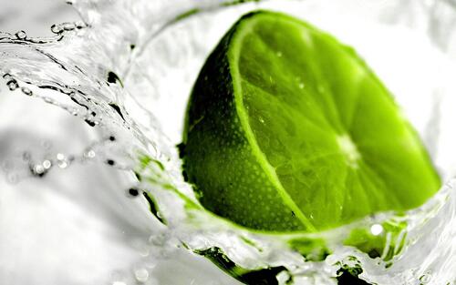 Half a lime falls into the water