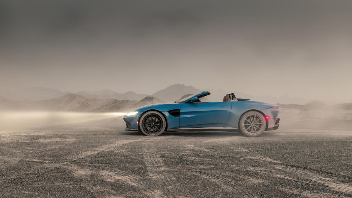 Aston Martin Vantage in a dusty quarry.