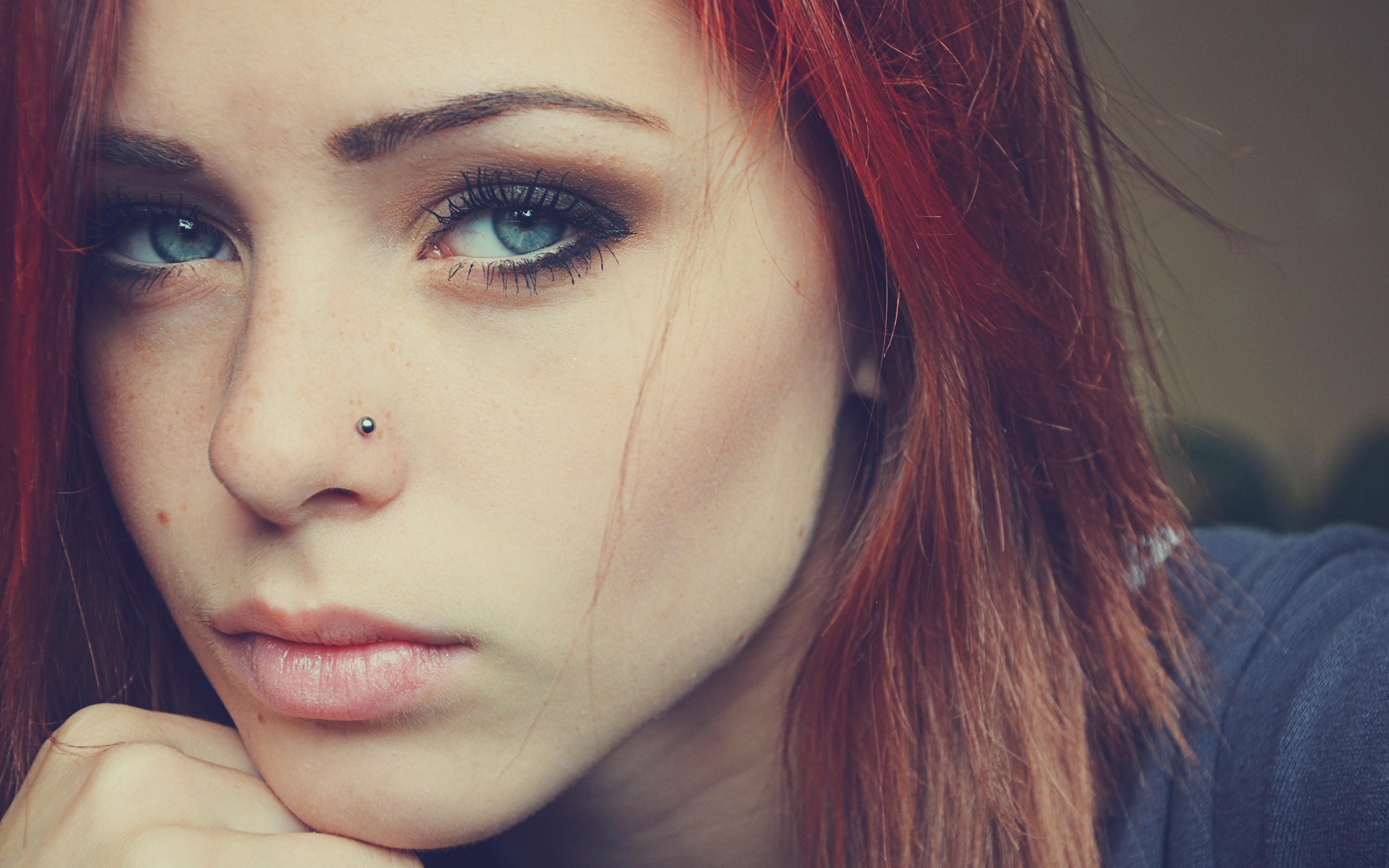 The redhead with the nose piercing.