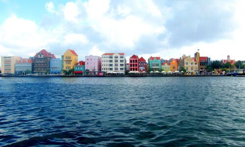 A city with colored houses on a sunny afternoon