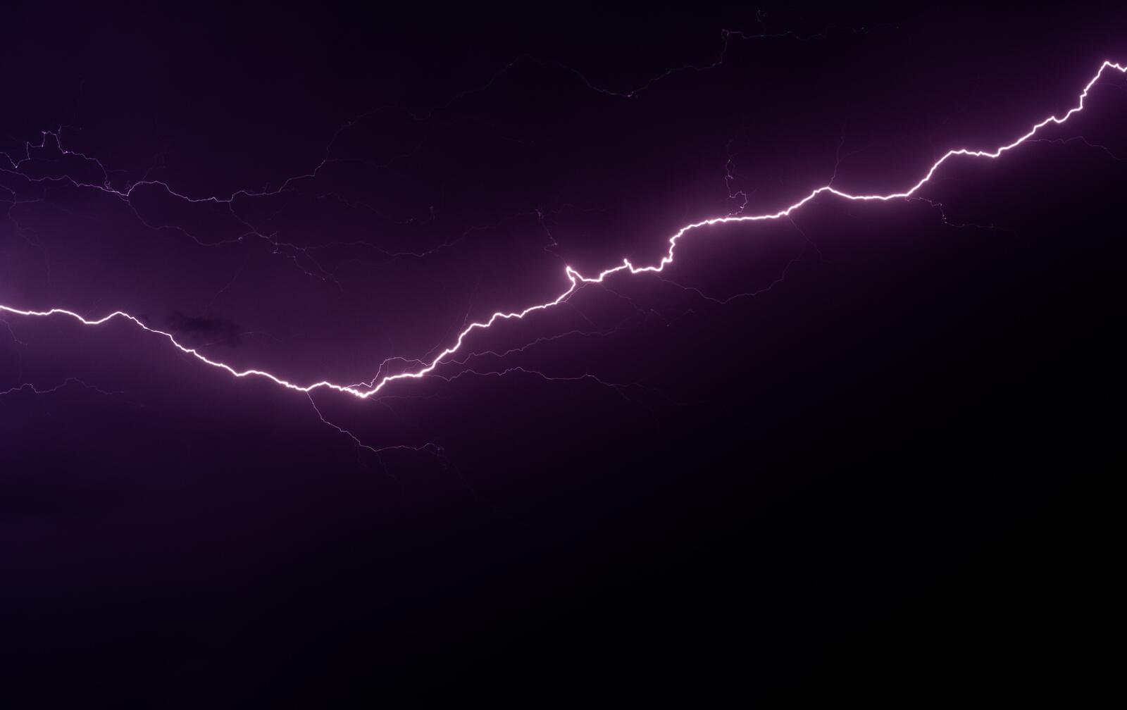 Free photo Pink lightning in the night sky