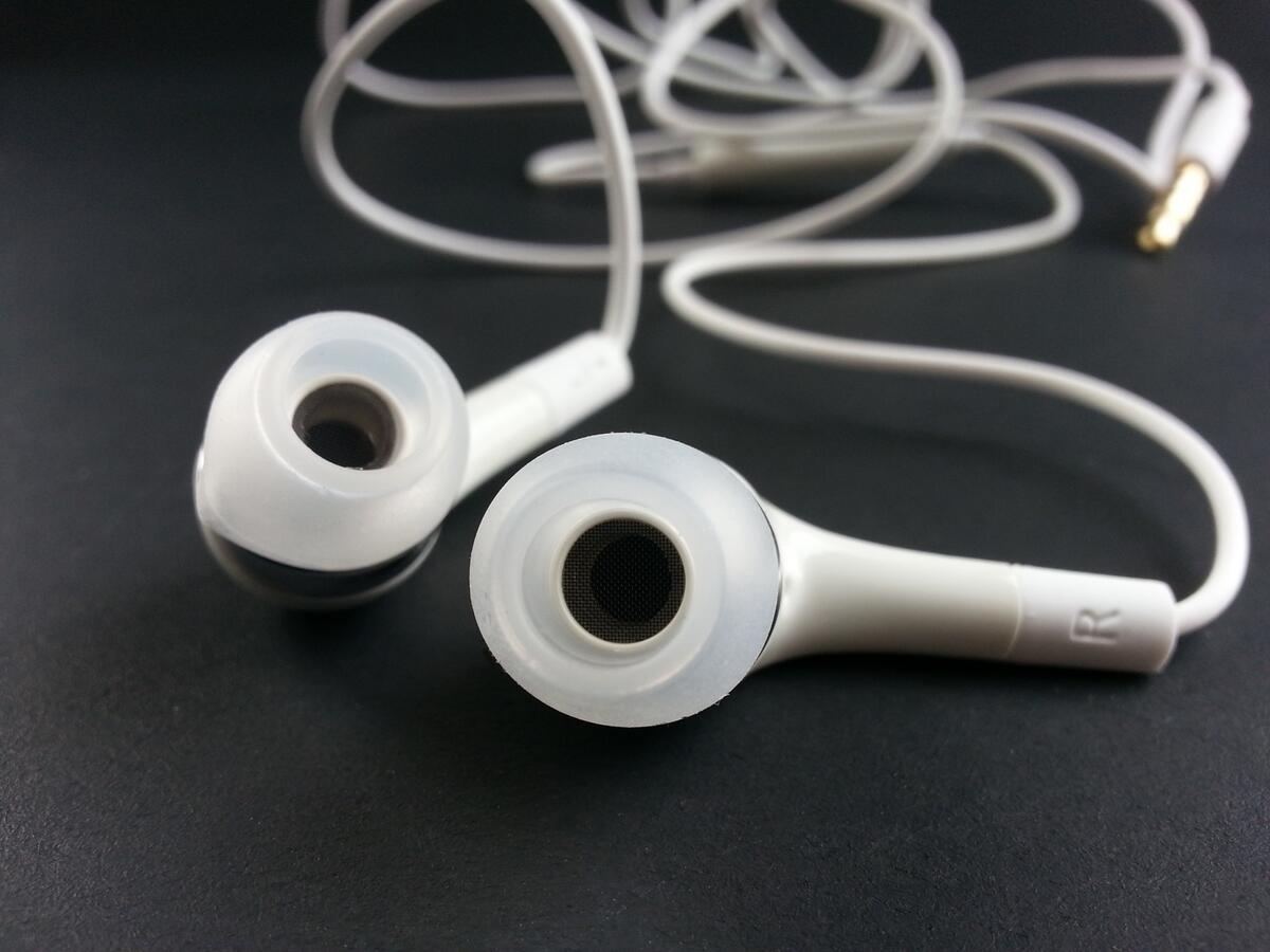 White headphones on a gray background