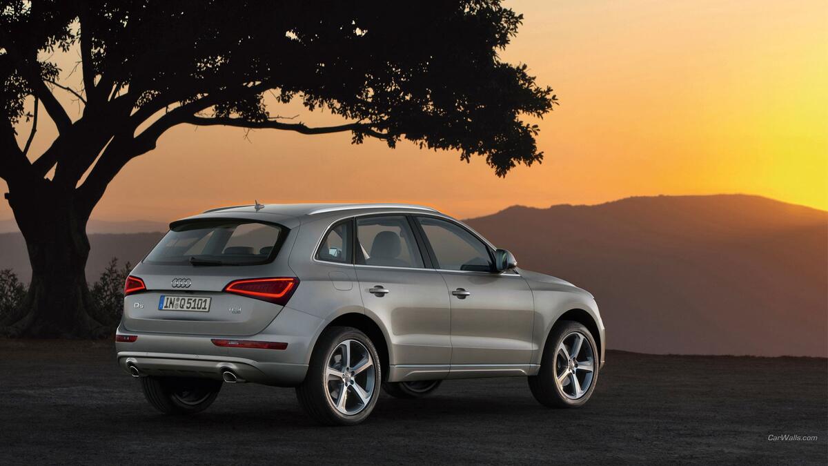 Silver Audi Q5 at sunset