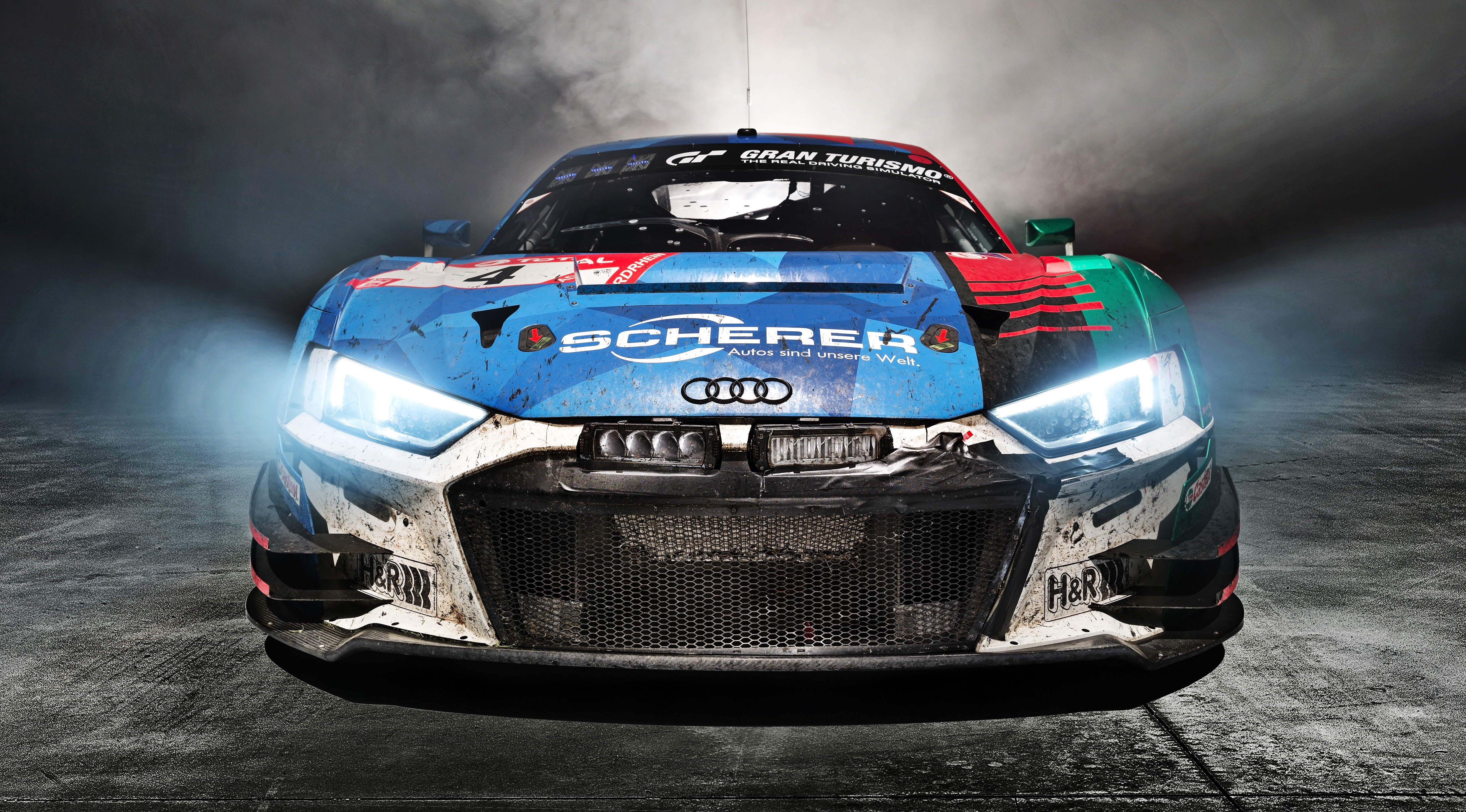 Front of audi r8 lms with headlights on