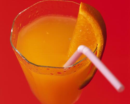 Orange juice with a straw