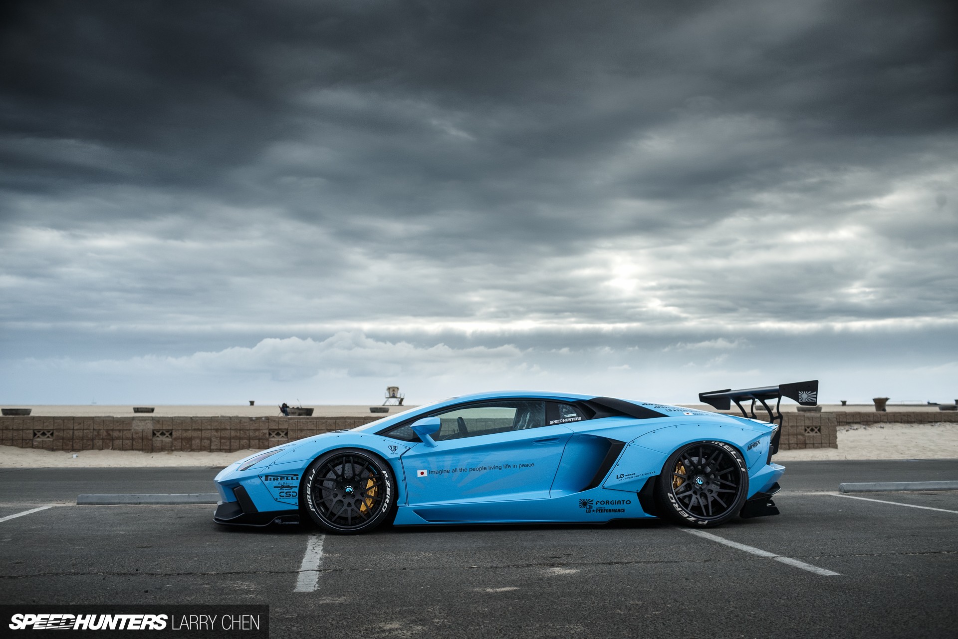 Blue Lamborghini Aventador side view.