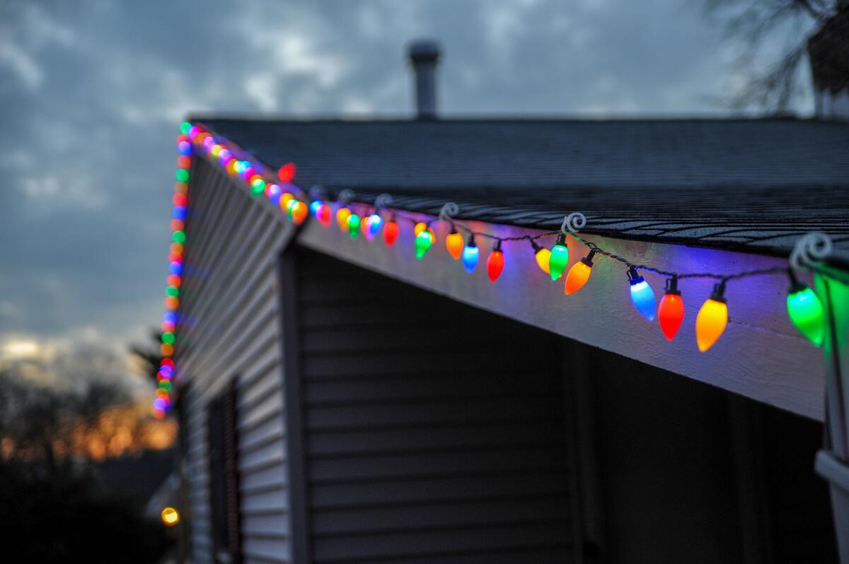 New Year`s garland on the roof of the house