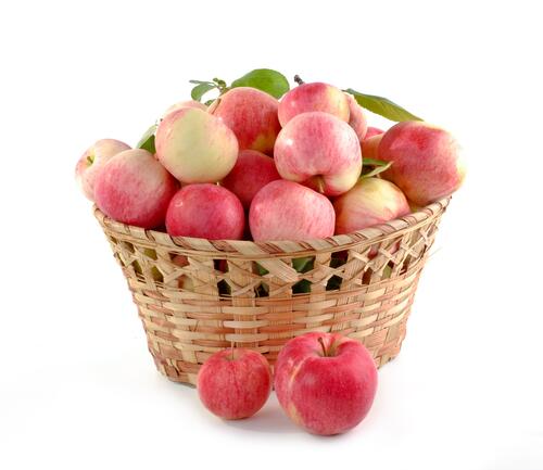 Basket with delicious ripe apples