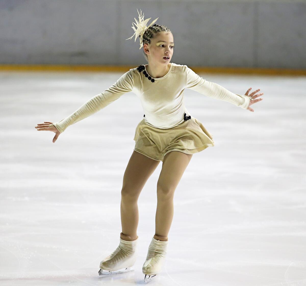 A figure skater on ice skates