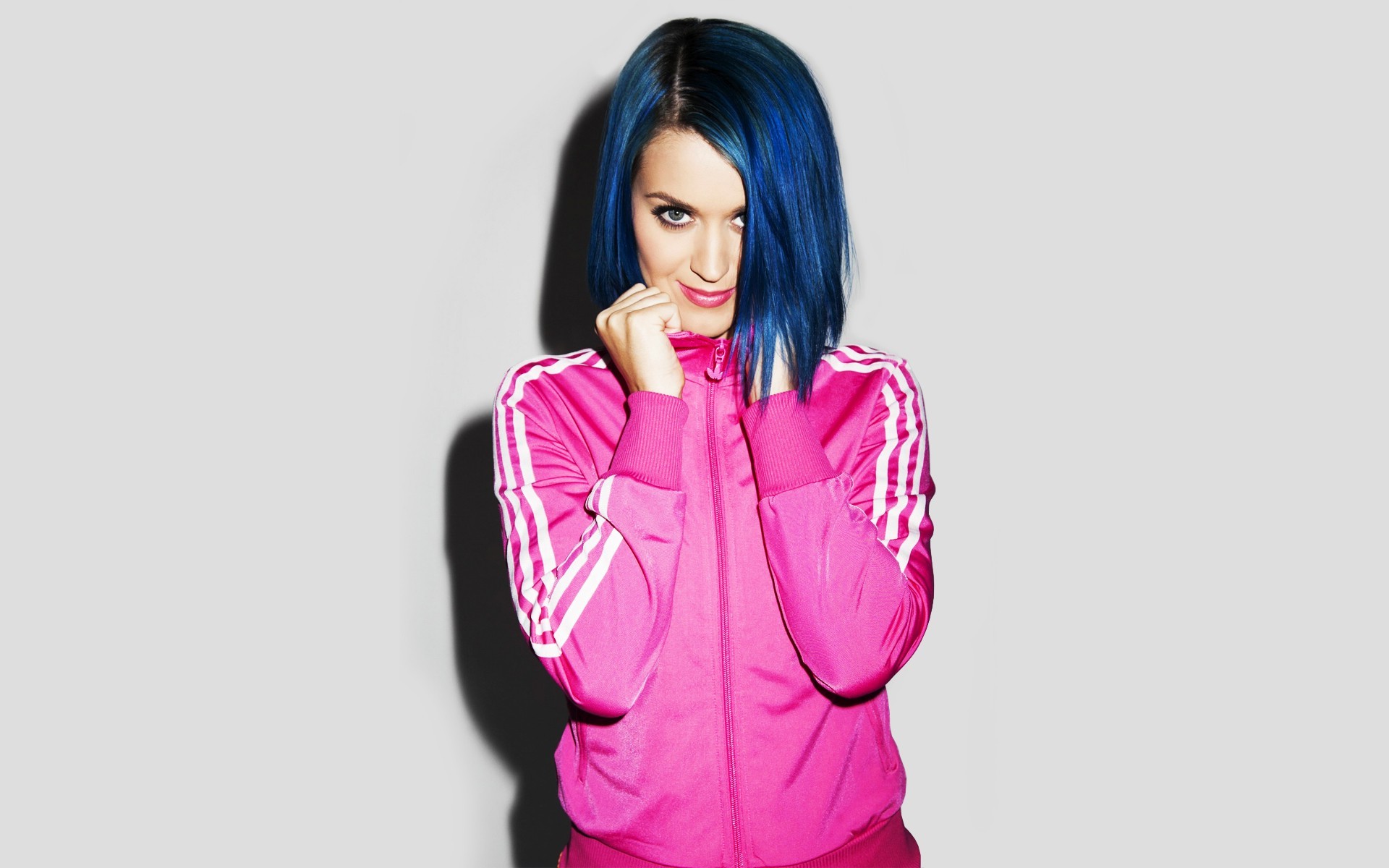 Katy Perry in a pink tracksuit.