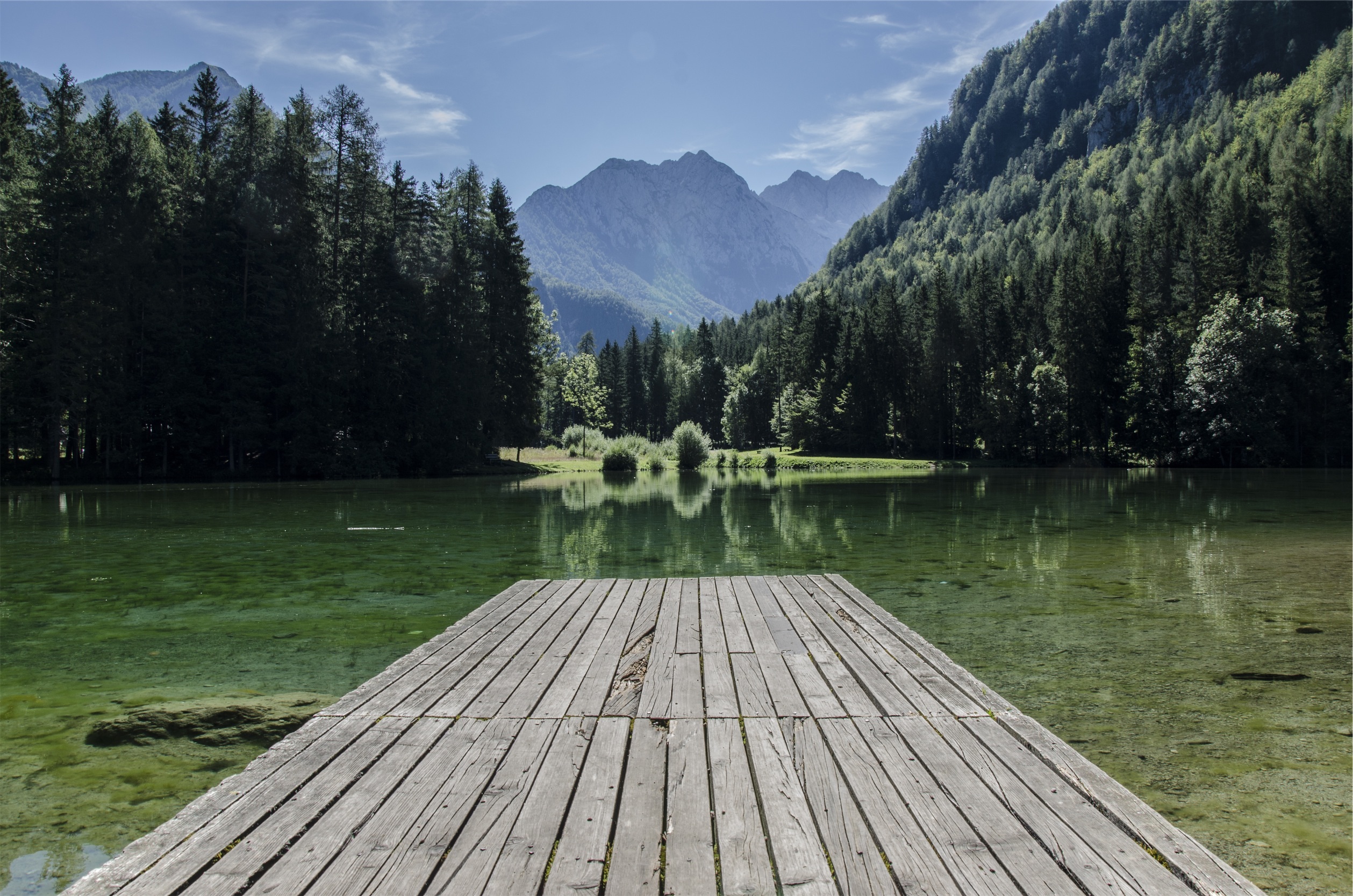 Wooden bridge on a lake in the mountains