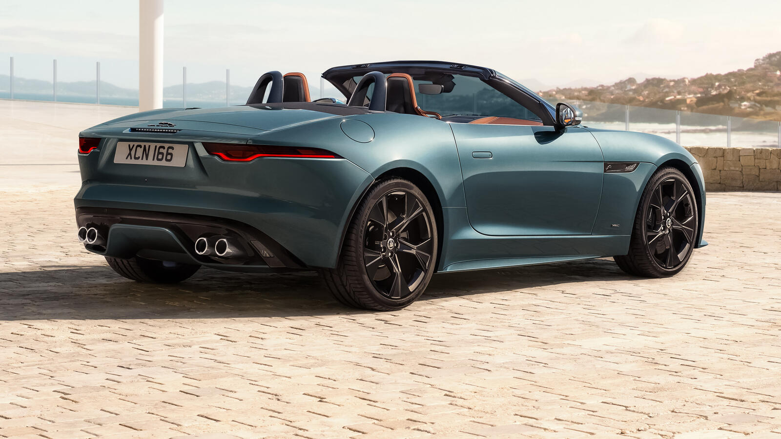 Free photo Sporty Jaguar F-type 75 R Convertible parked on a paving stone